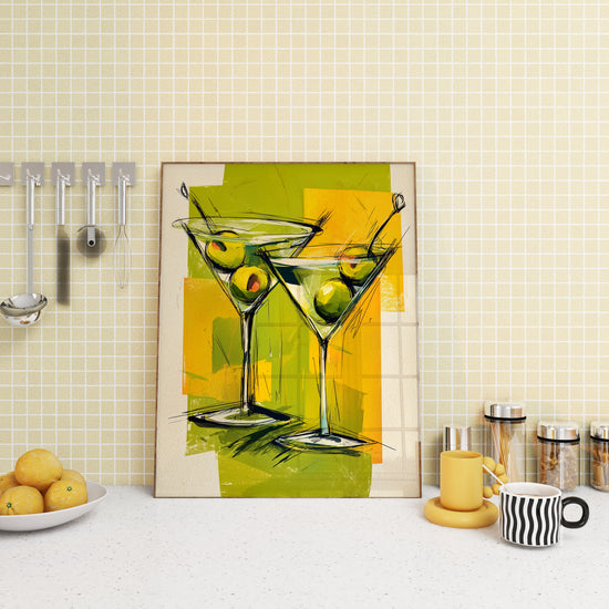 Tableau coloré représentant deux verres à martini avec olives vertes, idéal pour une décoration de cuisine conviviale.
