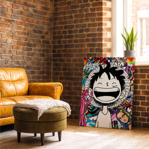 Un tableau coloré au style manga et street art est posé au sol contre un mur en briques. À côté, il y a un fauteuil en cuir jaune et un petit pouf rond avec un plaid.