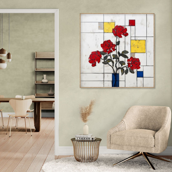 Tableau mural avec roses rouges sur fond géométrique coloré, ambiance moderne et chaleureuse dans salon élégant