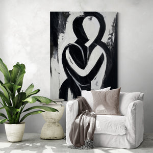 Tableau abstrait en noir et blanc représentant une étreinte, style moderne, dans un salon épuré et lumineux