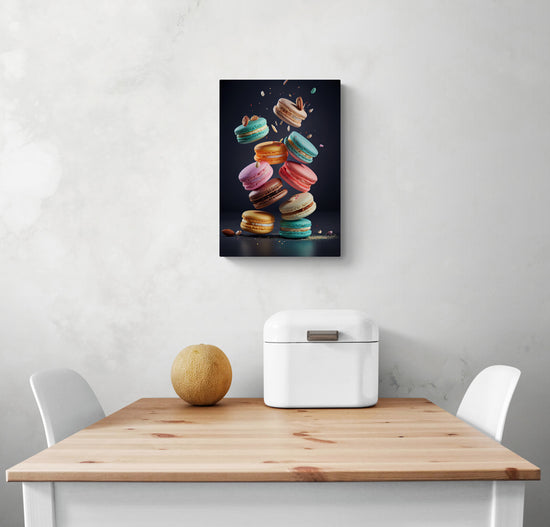 Un salon aux tons blanc et épuré où est accroché un cadre déco de petite taille d'une pile de macarons, multicolores, aux couleurs vibrantes et éclatantes qui donnent envie de croquer dedans. Leur manufacture artisanal les rend très attirant et envoûtant. Ces délicieuses gourmandises donnent envie d'être goûtées.