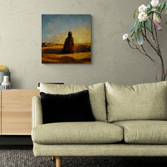 Petit tableau de décoration d'un touareg dans le desert, accroché sur le mur d'un salon, au cœur du désert un Touareg s'agenouille en contemplant le coucher du soleil. Vêtu d'un takakat et coiffé de son tagelmust, Il admire le ciel doré. Le touareg est à genoux, dans une position ressemblant à celle de la prière, comme pour remercier le tout puissant de cette scène qui s'offre à lui